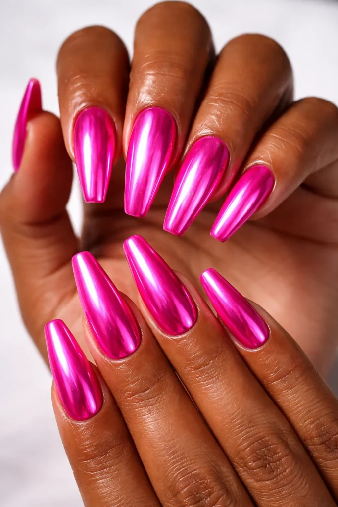 Hot pink chrome nails with mirror finish, bold trendy pink nail ideas.