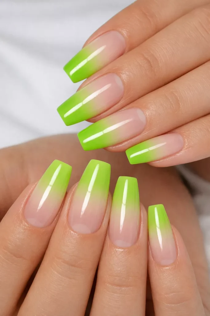 Coffin nails featuring lime green gradient ombré effect