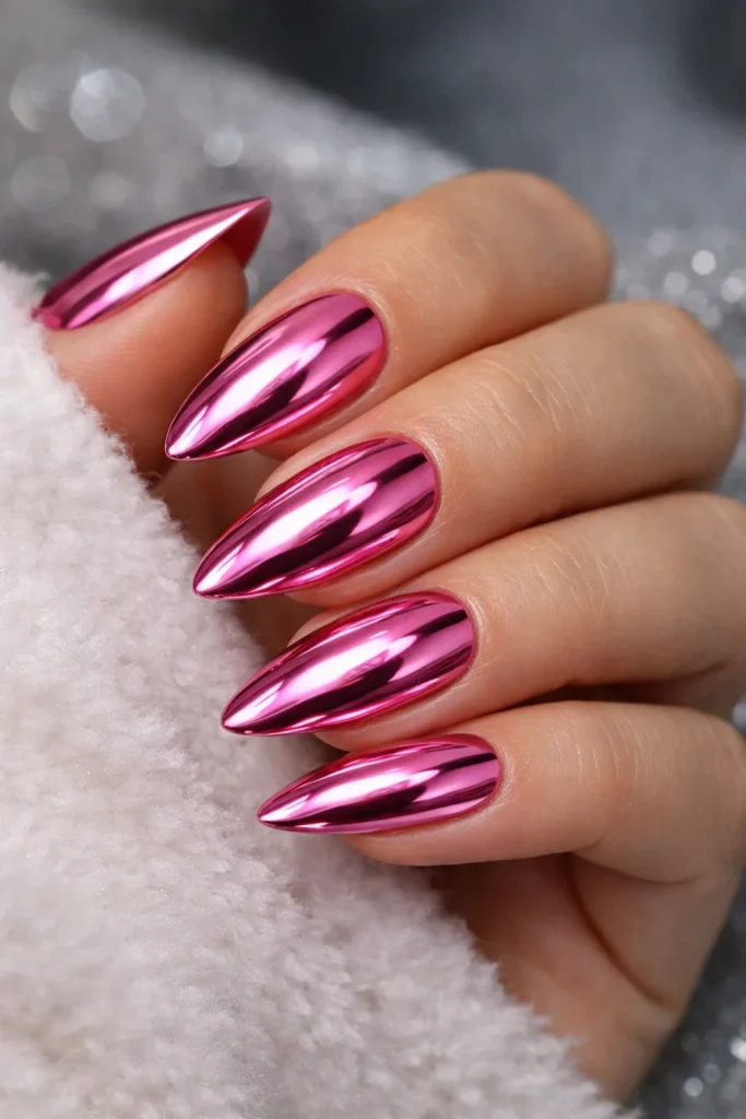Metallic rose gold pink nails with liquid metal finish, glam pink nail ideas.
