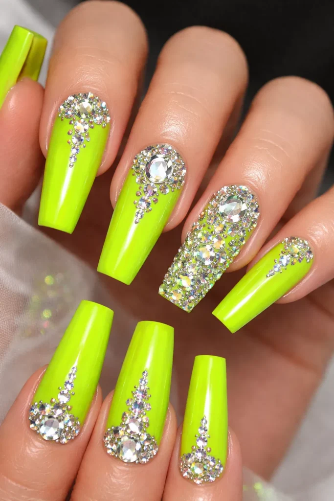 Coffin neon green nails decorated with rhinestones