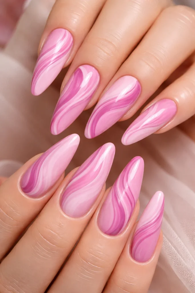 Abstract swirl pink nail ideas with blush and fuchsia curves.