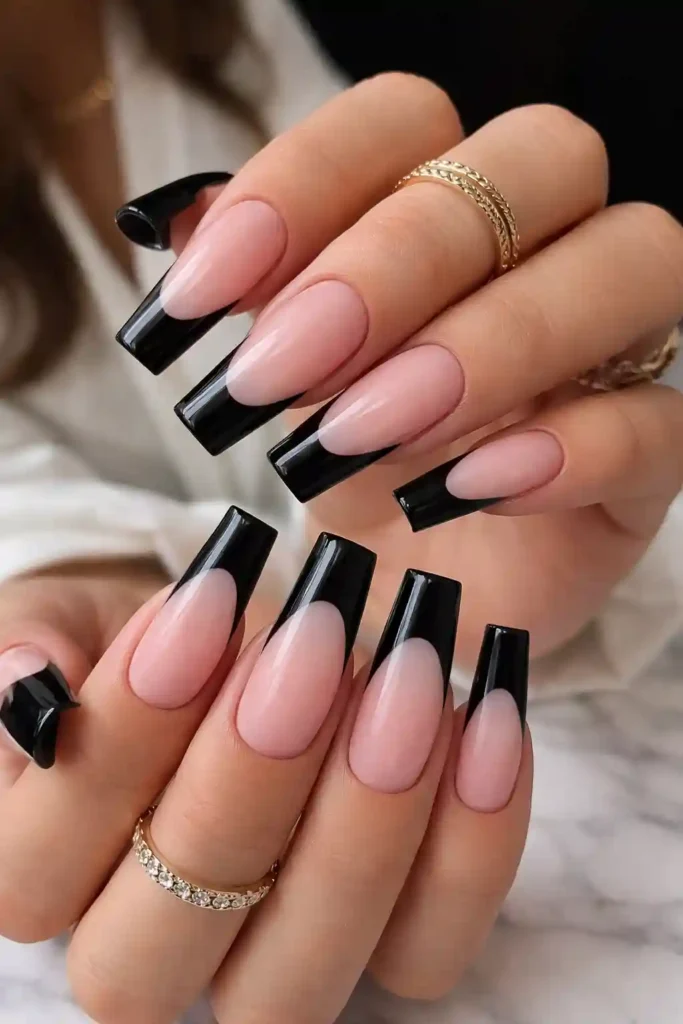 Elegant black French tip coffin nails with nude base