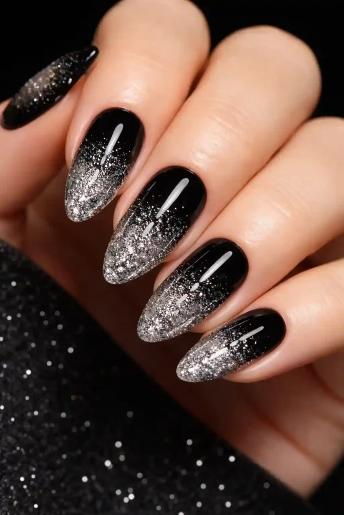 Black glitter ombre nails with sparkling silver gradient tips