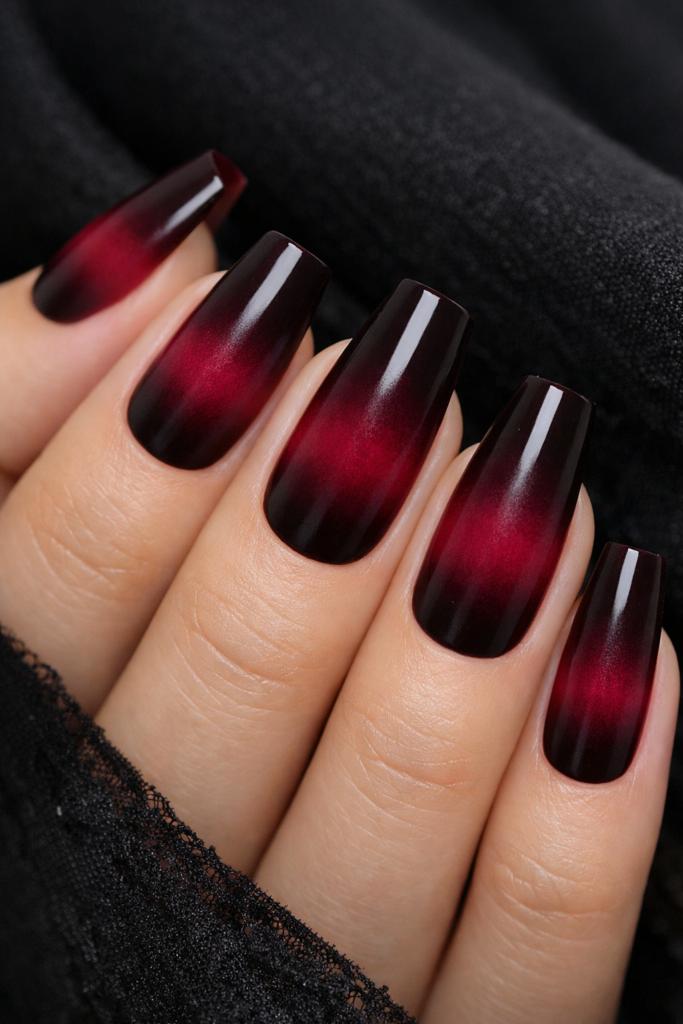 Burgundy gradient nails transitioning from near-black wine to bright berry on coffin shape
