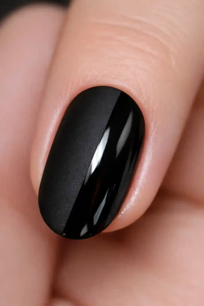 Matte and glossy black split nail art design