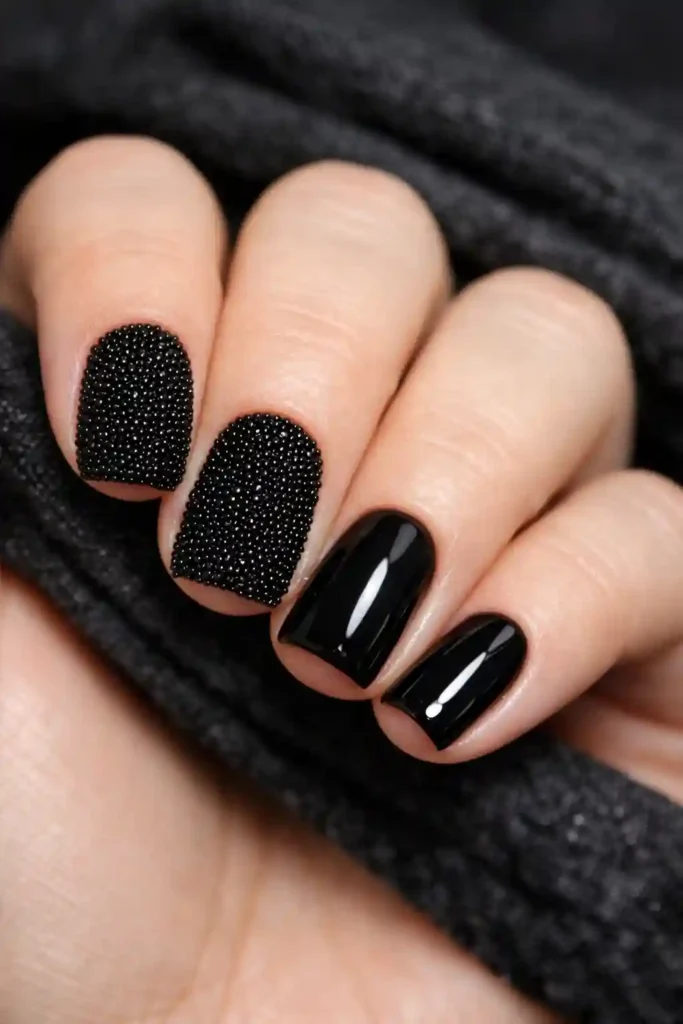 Matte caviar nail art with shiny black polish accents