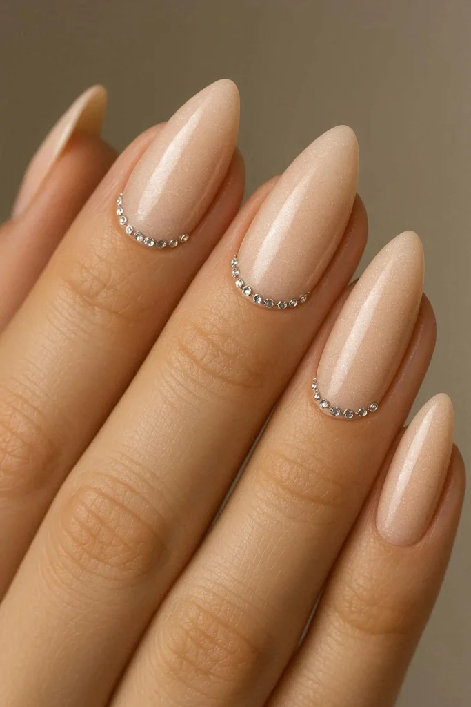 Almond acrylic nails with micro rhinestone cuticle accents