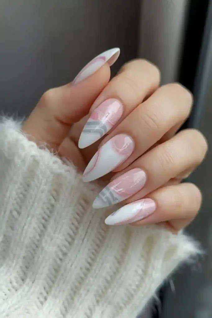 Almond shaped gel nails in sheer pink with glossy finish
