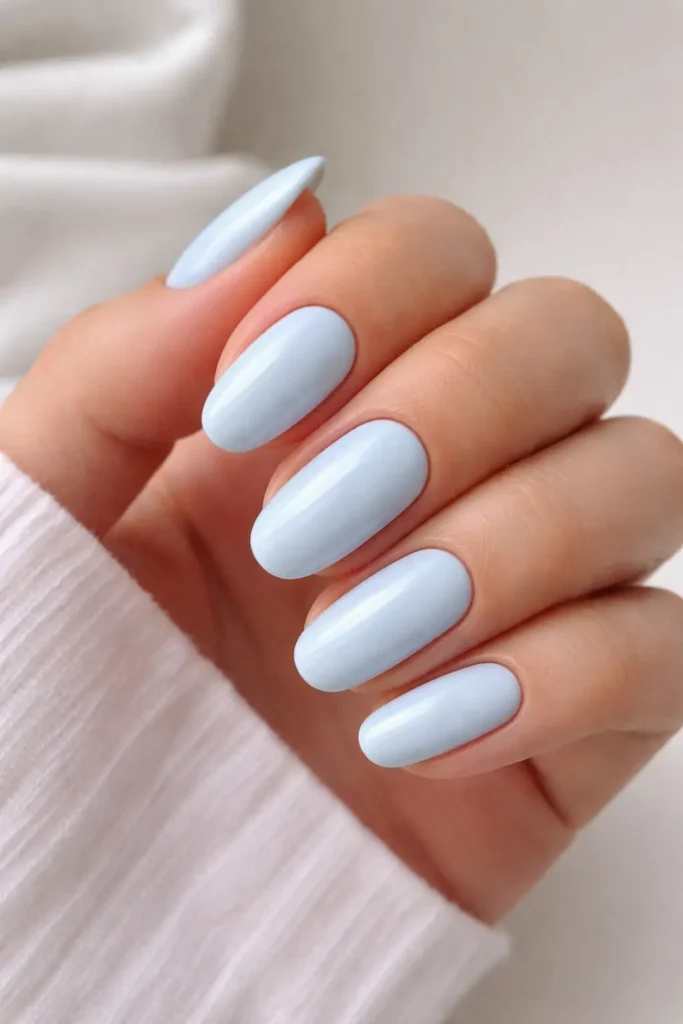 Baby blue minimal nails on short oval shape
