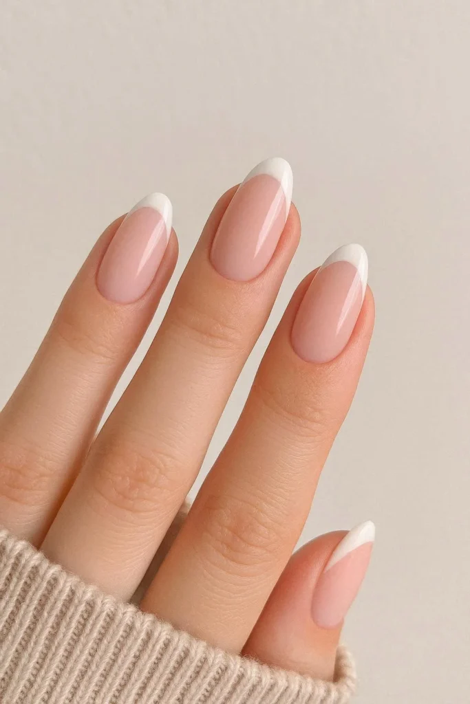 Ballet pink acrylic nails with delicate white French tips
