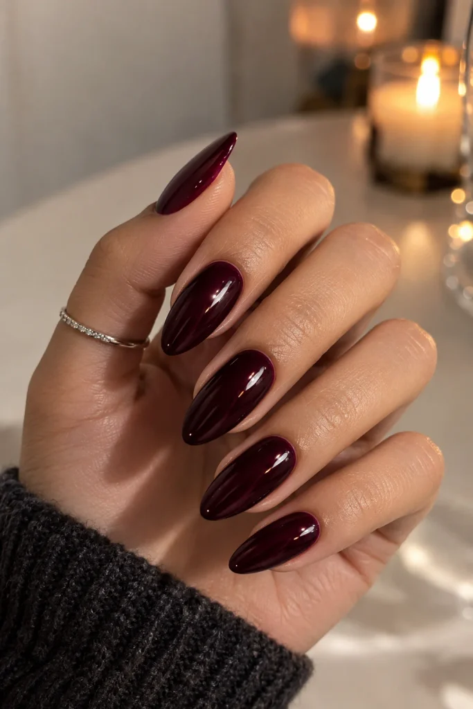 Black cherry glossy almond nails in deep burgundy
