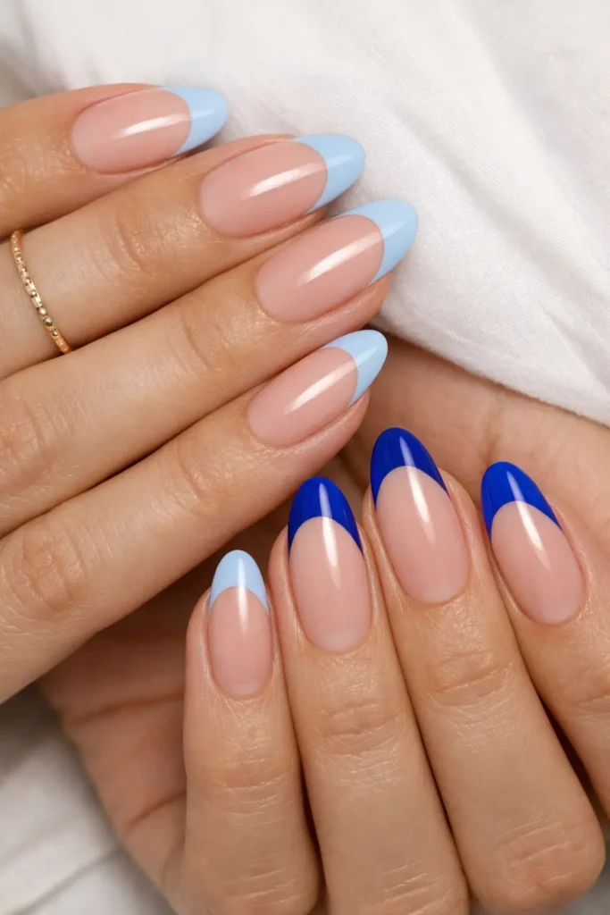 Modern blue French tip nails on almond shape