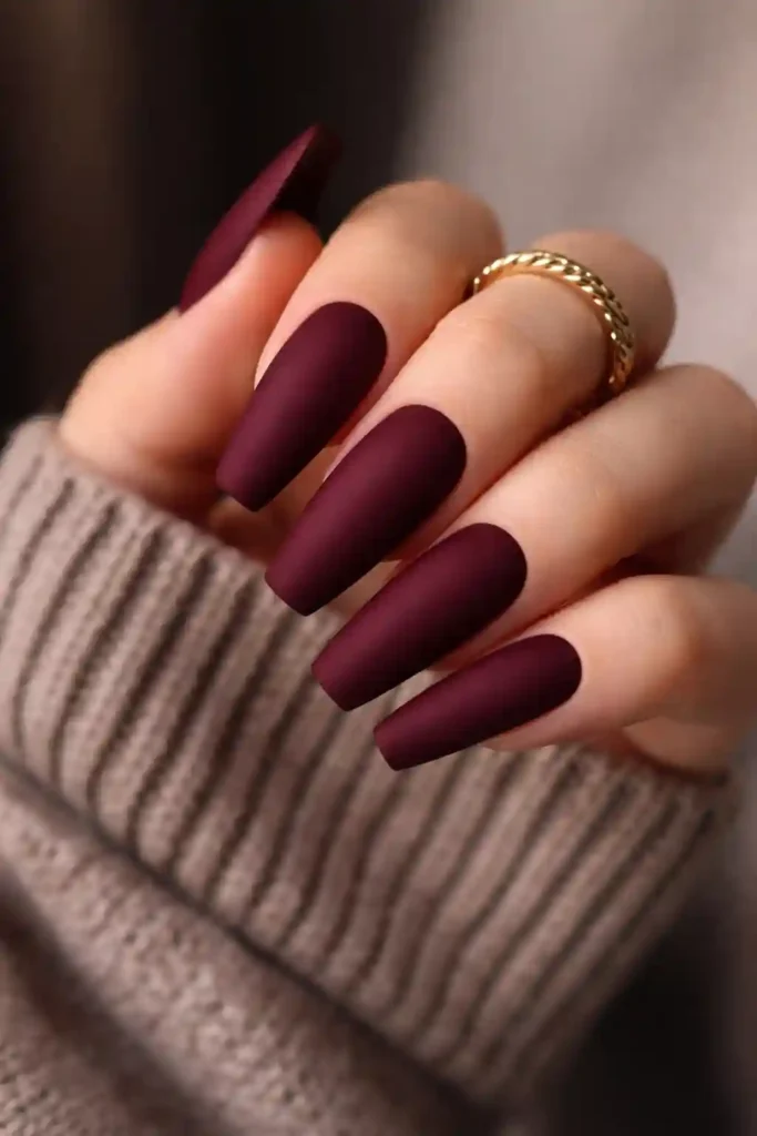 Deep burgundy matte coffin nails with a rich velvet-like finish