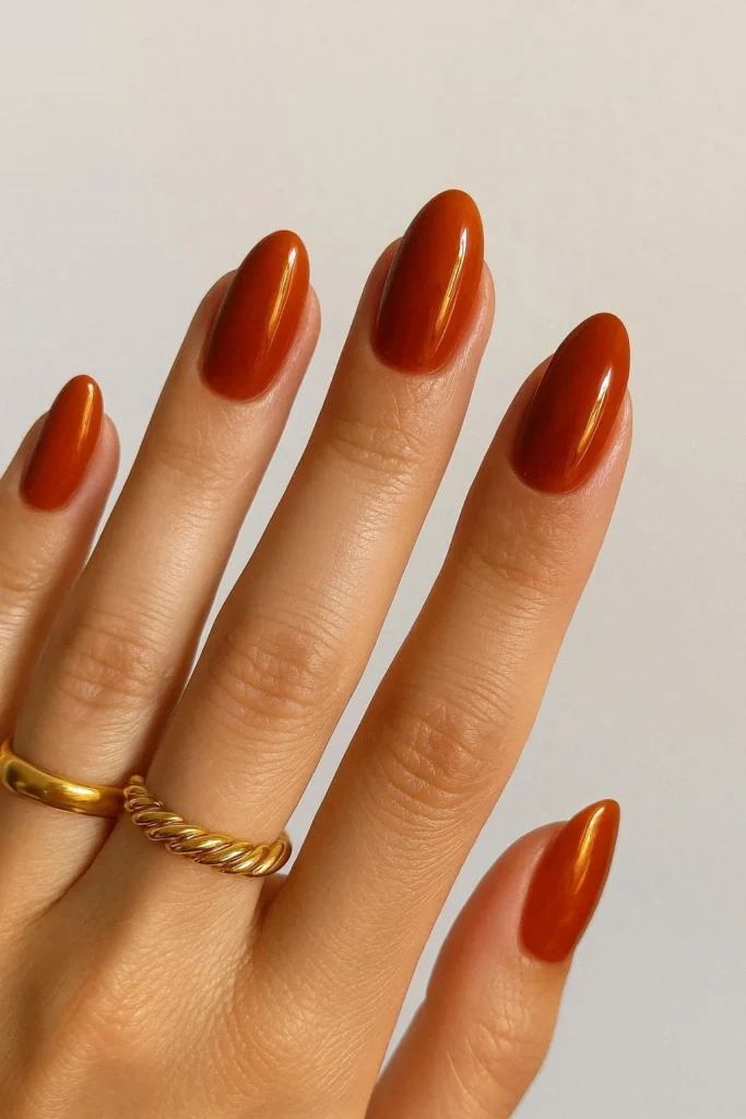 Burnt orange glossy nails inspired by end of summer sunset vibes