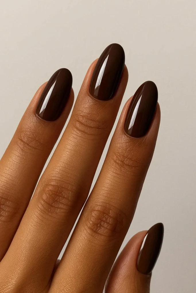 Chocolate brown glossy nails as a summer to fall nail color trend