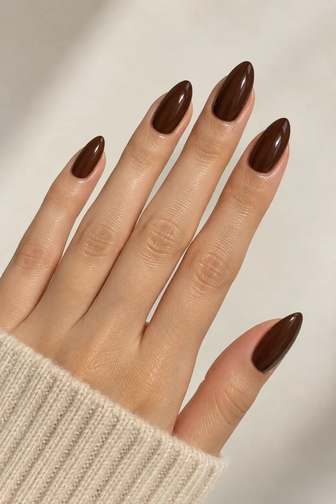Glossy chocolate brown almond nails with a rich finish