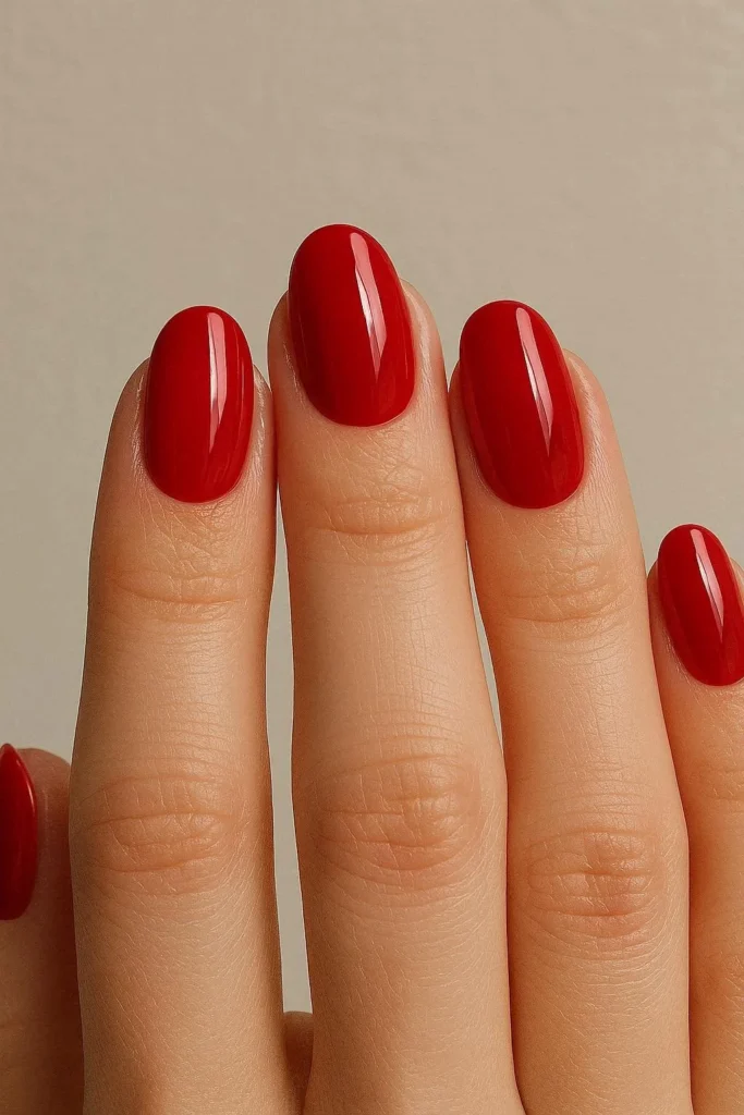 Classic cherry red oval shaped acrylic nails with glossy finish