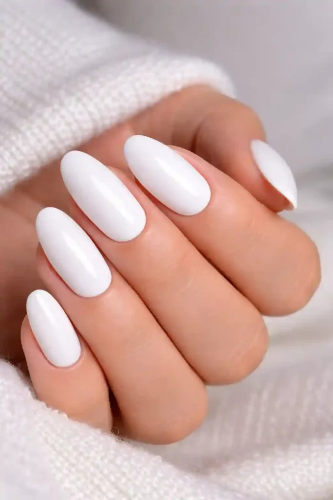 Classic glossy white nails with a high-shine finish on short square nails