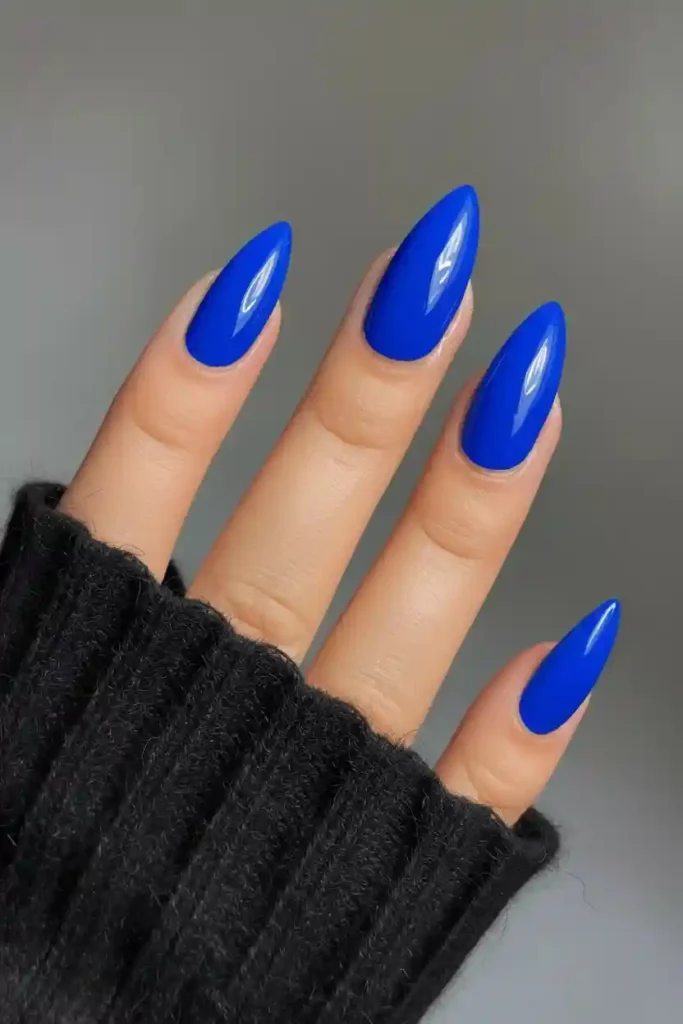 Cobalt blue almond nails with high-gloss saturated finish