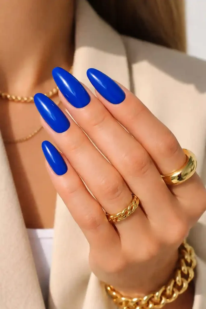 Vivid cobalt blue nails with high-shine glossy finish
