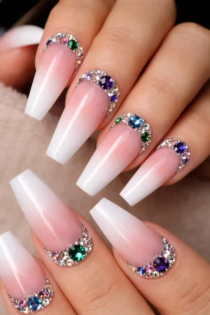 Coffin nails with crystal rhinestones clustered at the cuticle line for a glamorous effect