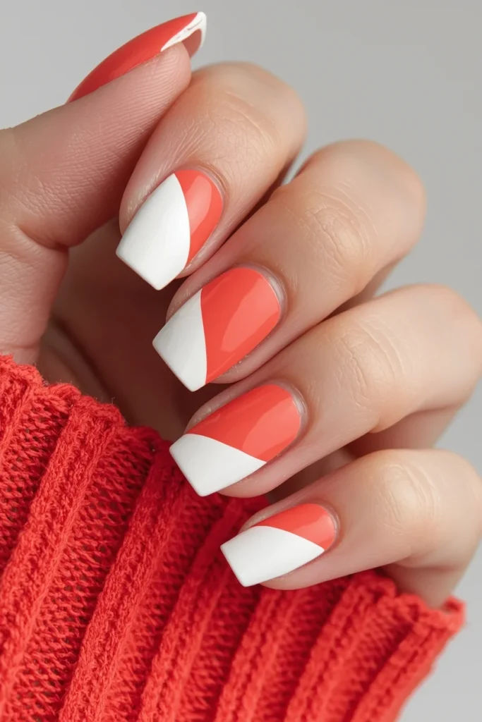 Coral and white geometric nail art with color blocked triangles and half moon shapes on short square nails