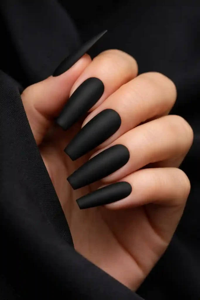 Dark matte black coffin nails with a velvety non-reflective finish