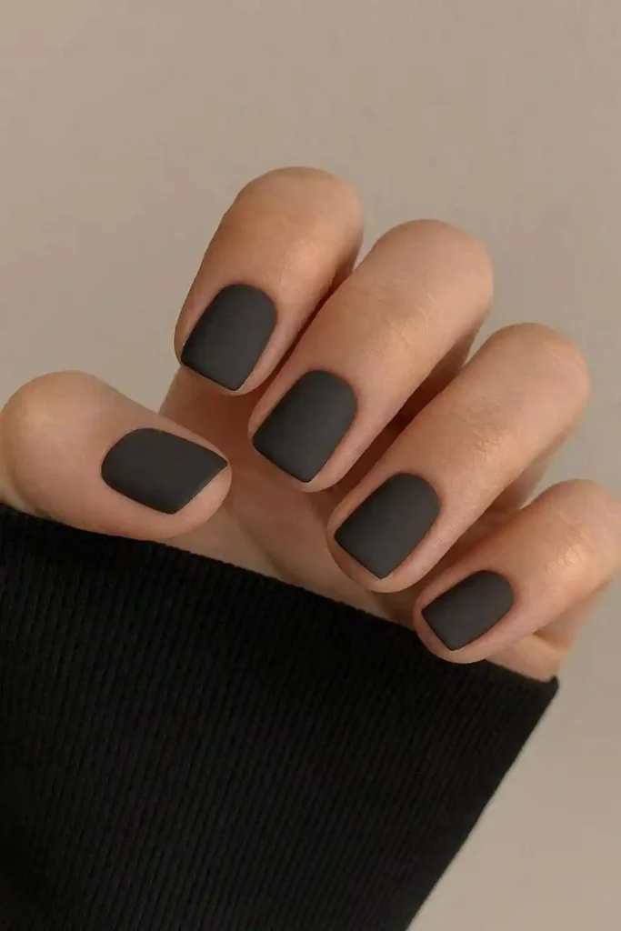 Dark minimalist nails in solid chocolate brown on short square nails
