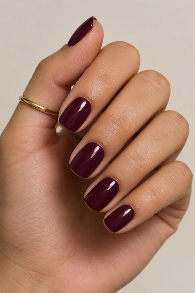 Deep plum cream nails with glossy mirror shine 