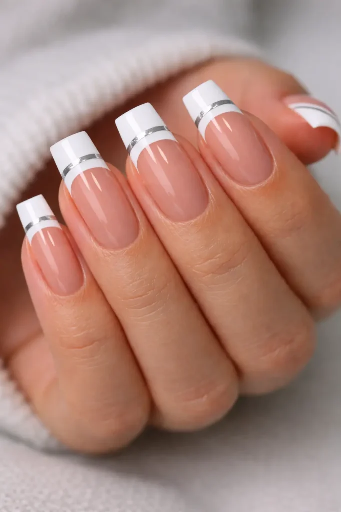 Double french tip nails with two parallel white and nude tip lines on square nails