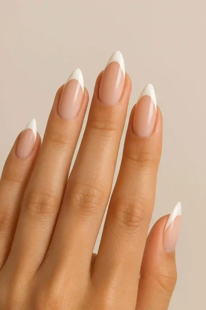French tip almond nails with white crescent on natural base
