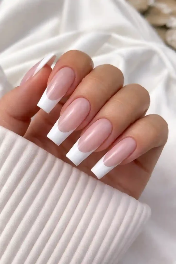 French tip coffin nails with a milky pink base and crisp white squared tip