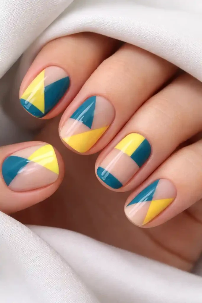 geometric lemon yellow and teal blue negative space nail art