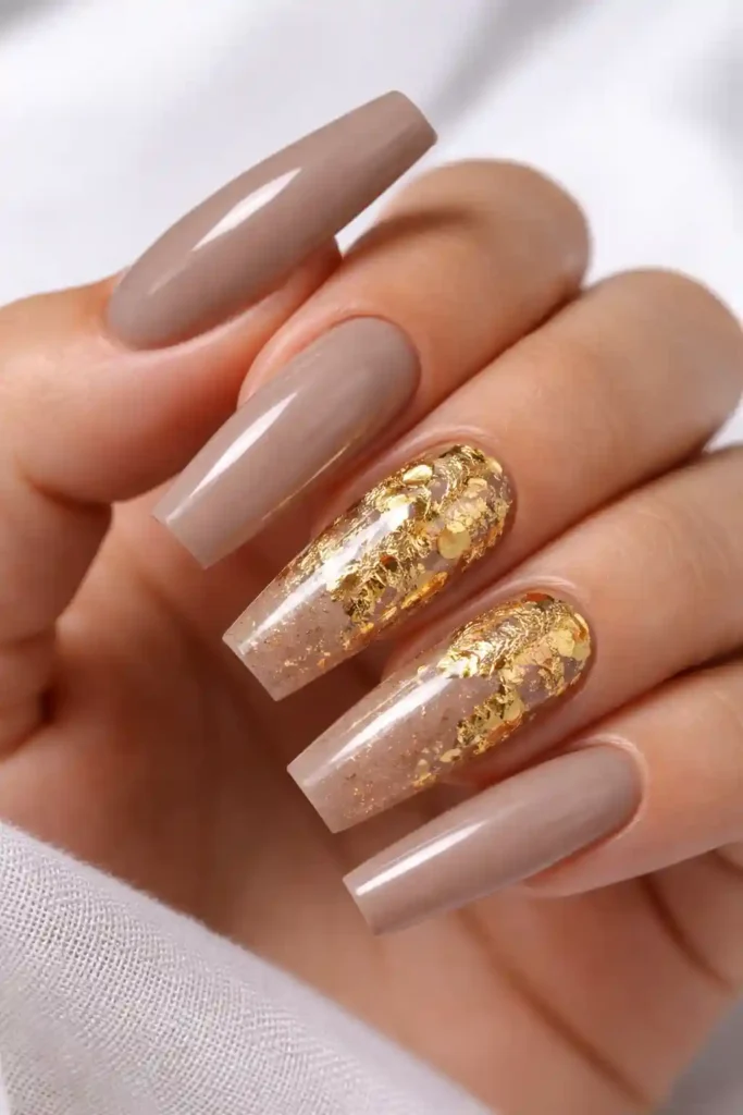 Neutral taupe coffin nails with crinkled gold foil accent on two nails