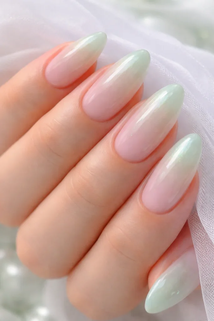 Jade glazed nails with a sheer translucent tint over a milky base for a dewy finish