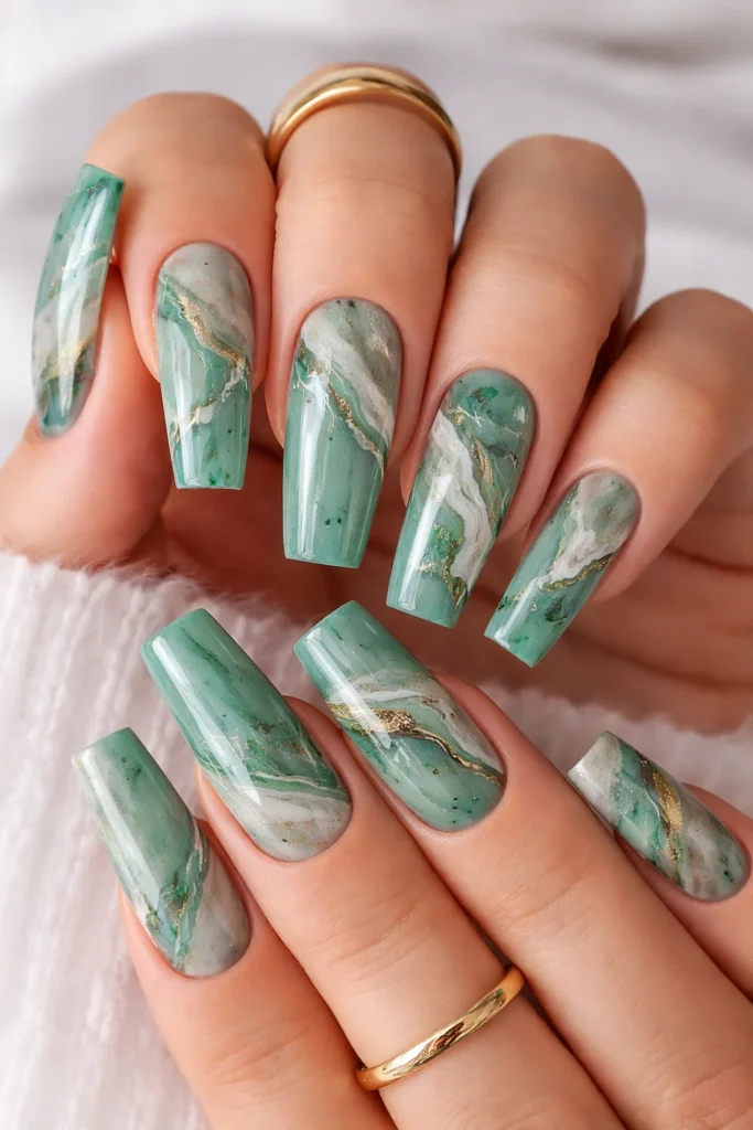 Jade marble nails with white and gold veining on a square coffin shape