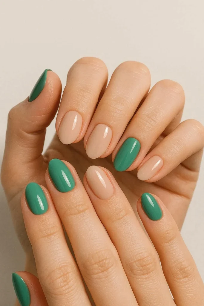 Jade green and nude two tone nails alternating in a modern colour block manicure
