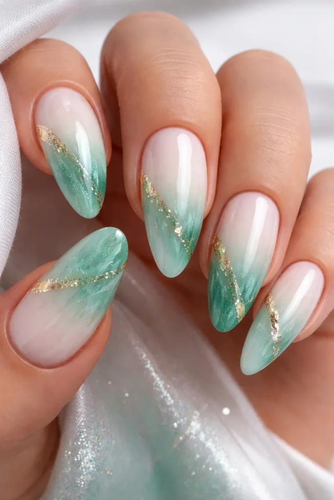 Jade ombre nails blending green into white in a soft watercolour gradient effect
