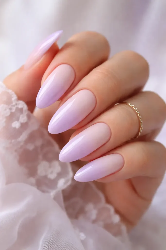lavender ombre nails with soft lilac to cream gradient on elegant almond shaped nails
