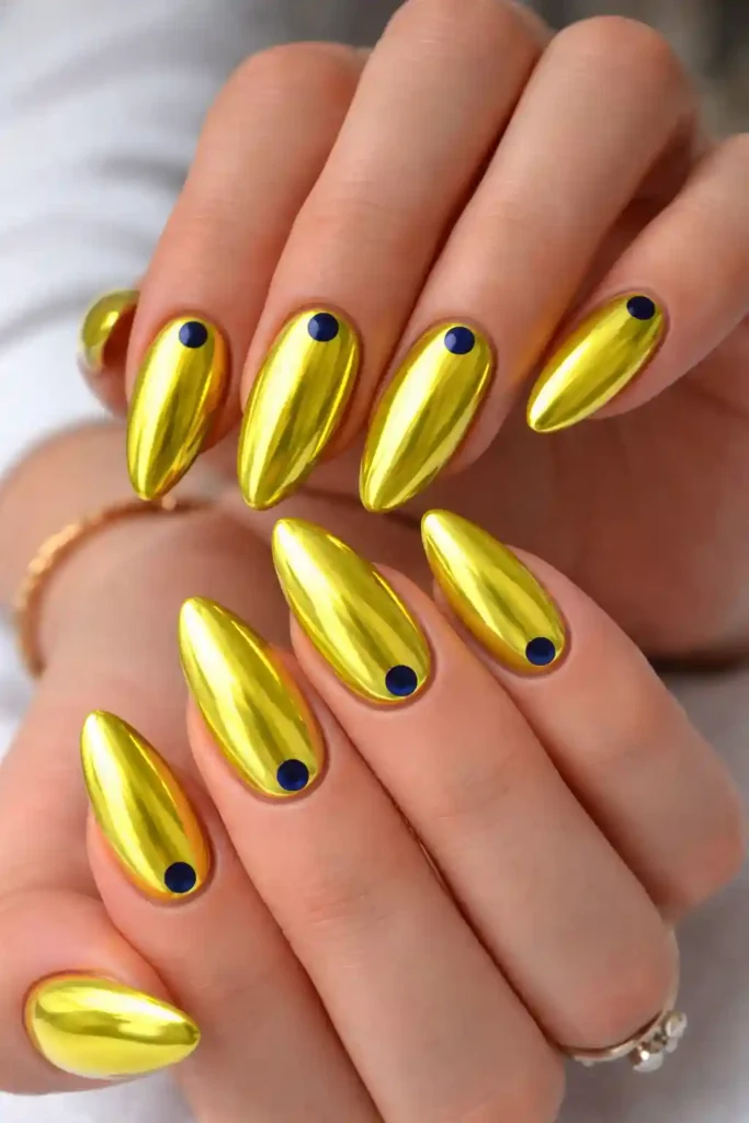 mirror finish lemon chrome nails with navy blue dot accents
