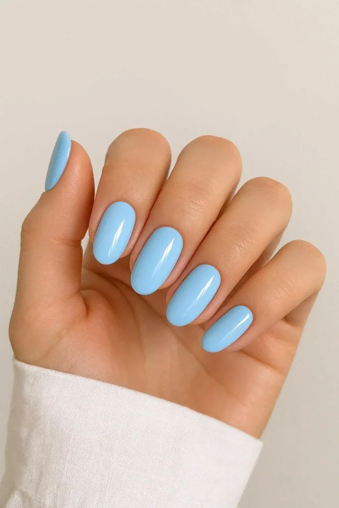 Light sky blue nails with a fresh airy glossy finish
