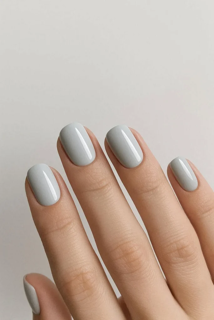 Light grey minimal nails with a sleek understated finish
