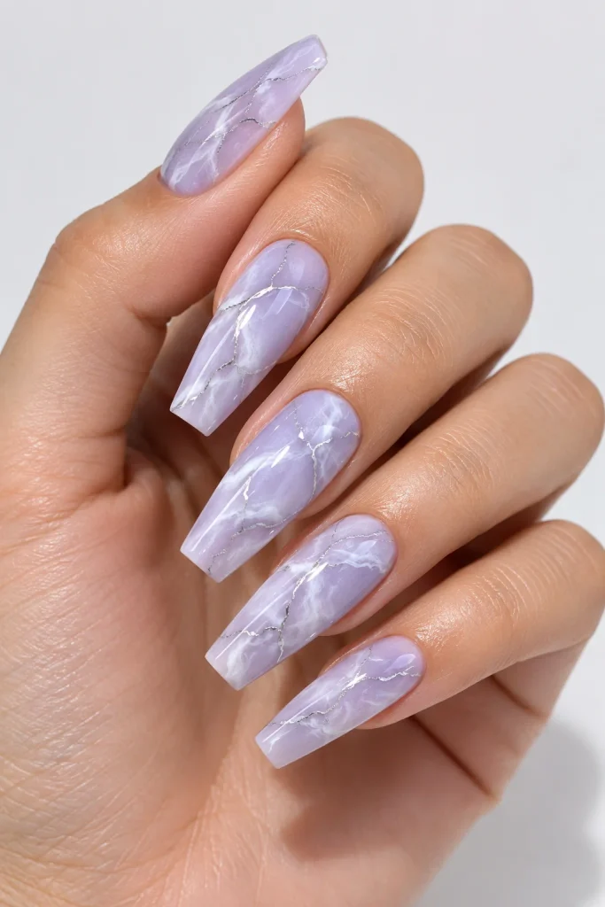 Lilac marble nails with delicate silver vein details 