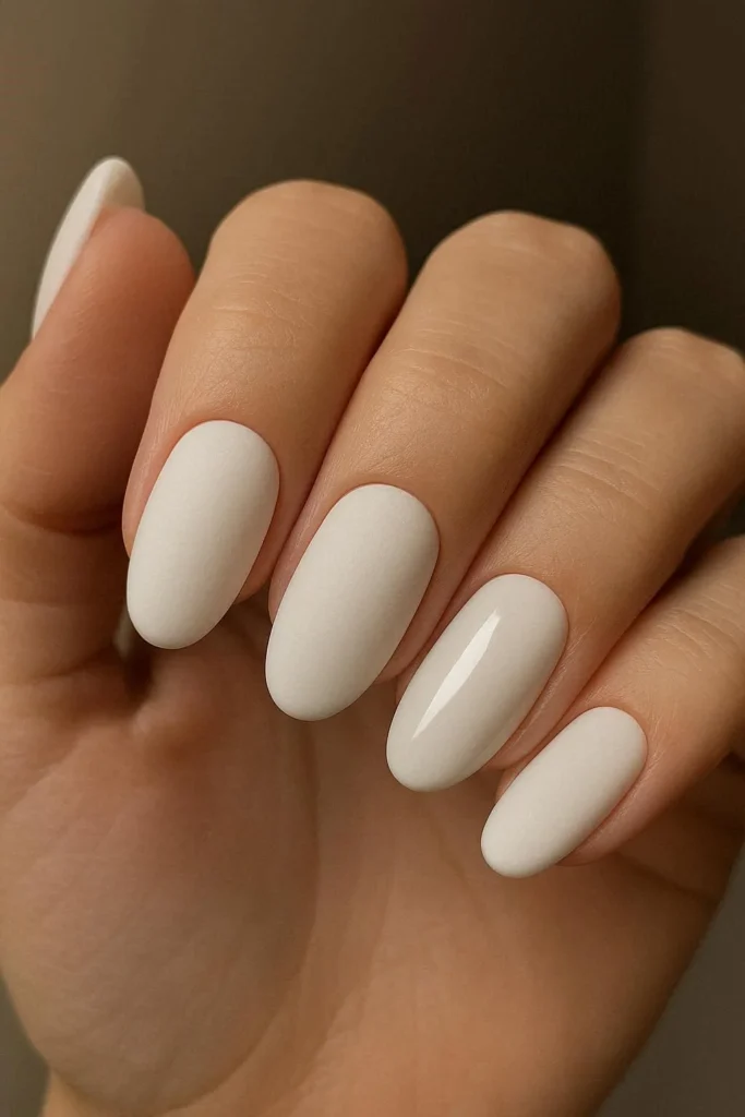 Matte white nails with one glossy accent nail
