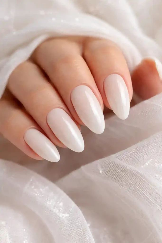 Milky white glazed donut almond nails with pearlescent sheer finish