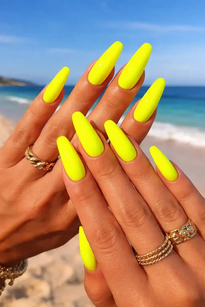 Neon yellow statement nails on coffin shape