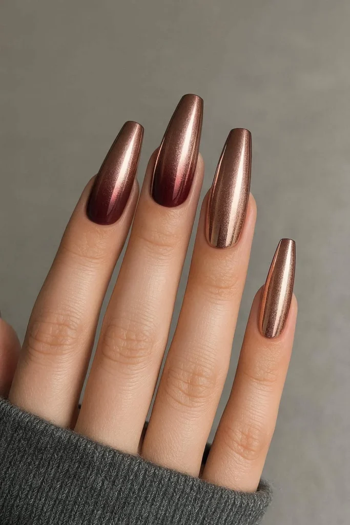 Long ombre chrome acrylic nails from burgundy to rose gold