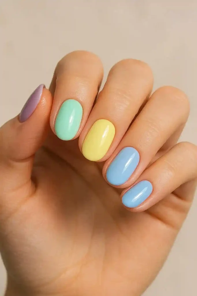 Pastel gel nails in soft lavender mint and baby blue shades
