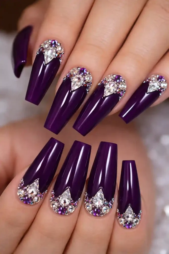Purple gemstone nails with amethyst base and rhinestone cluster on long coffin nails