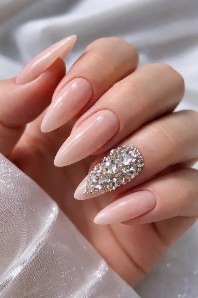 Nude nails with rhinestone cluster accent for birthday glam